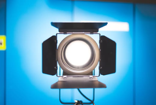 Professional studio spotlight in a TV studio. Lighting equipment for photography or videography.
