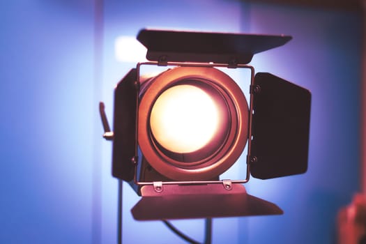 Professional studio spotlight in a TV studio. Lighting equipment for photography or videography.