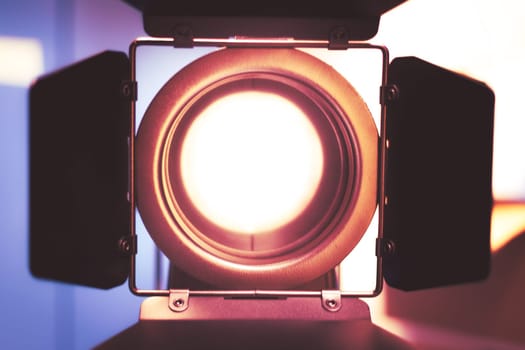 Professional studio spotlight in a TV studio. Lighting equipment for photography or videography.