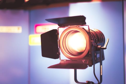 Professional studio spotlight in a TV studio. Lighting equipment for photography or videography.