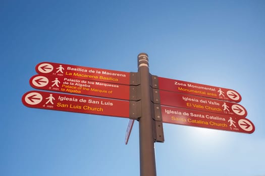 Seville, Spain - Sept 26th 2020: Macarena neighborhood directions signpost, historic district of Seville, Spain