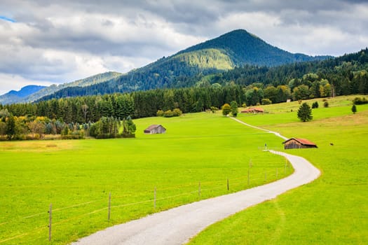 Scenic view of the countryside and narrow gravel road near Schwangau in Bavaria, Germany
