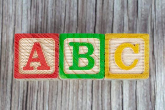 ABC wood block on wooden surface. Child education concept