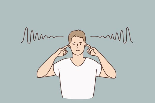 Covering ears and silence concept. Young sad irritated man cartoon character standing covering his ears with fingers with no sounds inside vector illustration