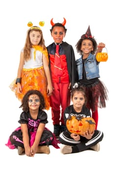Group of kids in Halloween/Carnaval costumes isolated