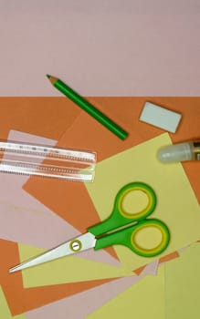 Set of school stationery supplies pencils, paint, ruler, and scissors lying on table. DIY Paper Crafts for kids. Back to school concept. Flat lay. Copy space.