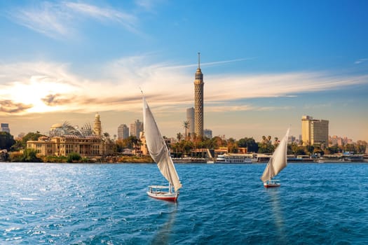 The Nile and feluccas in front of the Tower of Cairo, Egypt.