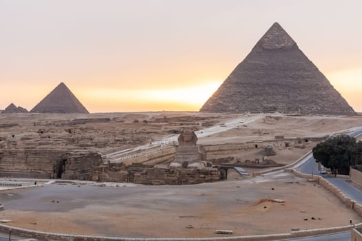The Sphinx, the Pyramid Of Khafre and the Pyramid of Menkaure in Giza at sunset, Egypt.