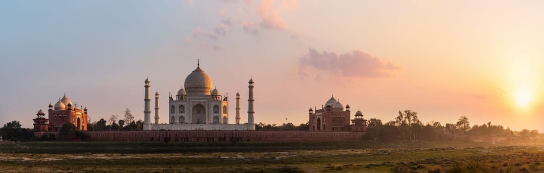Taj Mahal panorama, view from the Yamuna river at sunset, Agra, India.