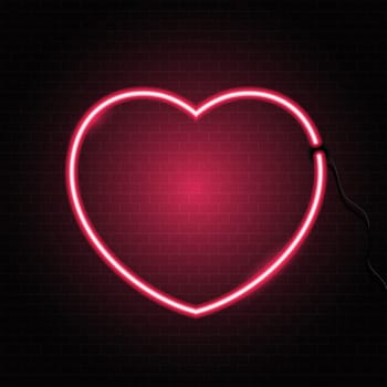 Glowing neon heart on a brick wall texture