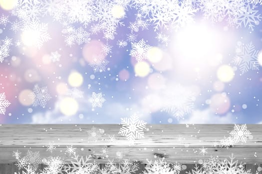 3D render of a Christmas background with wooden table against defocussed bokeh lights and snowflakes