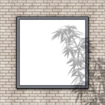 3D render of a blank picture frame on brick wall with plant shadow overlay
