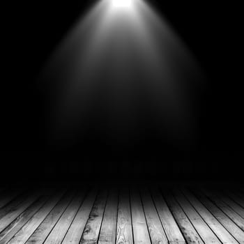 3D render of a spotlight shining down into a grunge interior with wooden floor