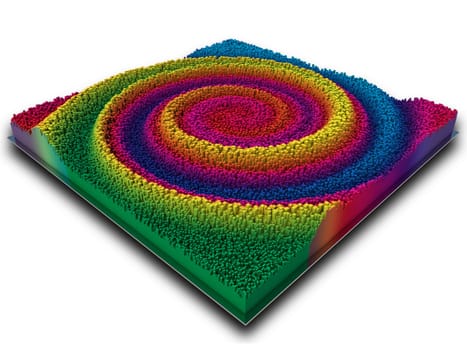 3D render of an abstract landscape in rainbow coloured extruding cubes