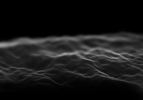3D render of digital landscape of flowing dots with shallow depth of field