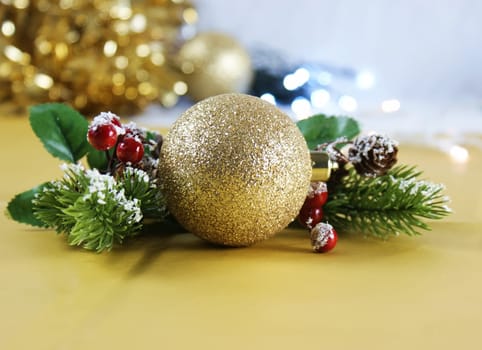 Christmas background with gold decoration with berries
