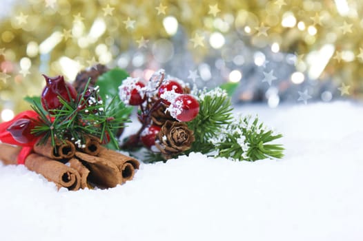 Christmas cinnamon and decorations in snow