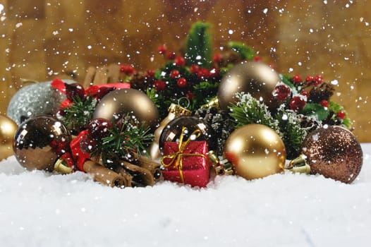 Christmas gift and decorations nestled in snow