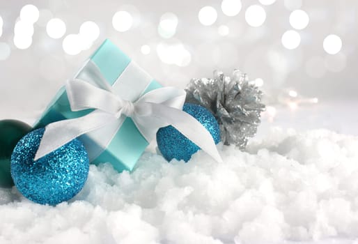 Christmas gift and decorations nestled in snow