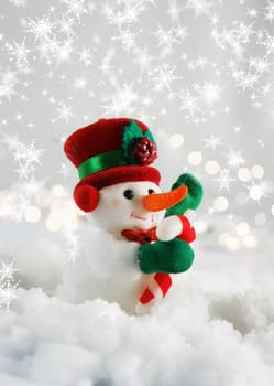 Christmas snowman nestled in snow