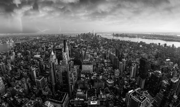 New York City skyline with Manhattan skyscrapers at dramatic vibrant after the storm sunset, USA. Black and white image.
