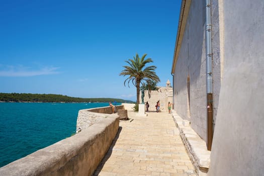 Viewpoint next to the Cathedral of the Assumption of the Blessed Virgin Mary in the old town of Rab in Croatia with a view of the Adriatic Sea