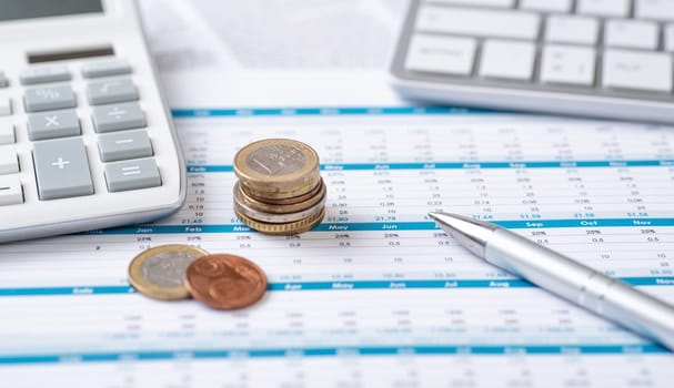 Coins on documents with a calculator