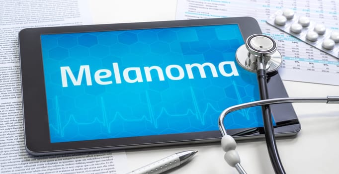 The word Melanoma on the display of a tablet