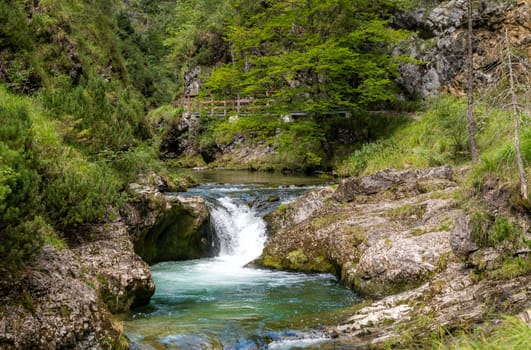 Waterfalls in the Weissbachschlucht in Chiemgau Bavaria with mountains and forest