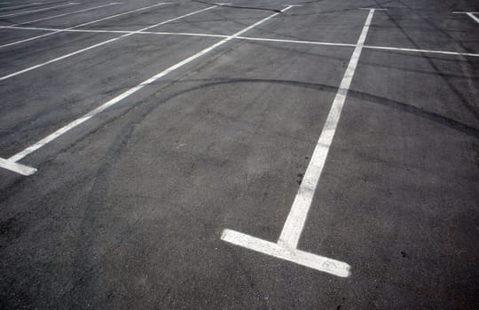 Parking kiosks in the parking lot, marked with white lines. Empty parking lot. Outdoor car park with freshly painted kiosk lines. Outdoor parking on an asphalt road