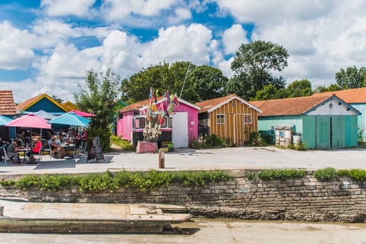 Colorful cabins on the harbor of Château d'Oléron, on the island of Oléron in France
