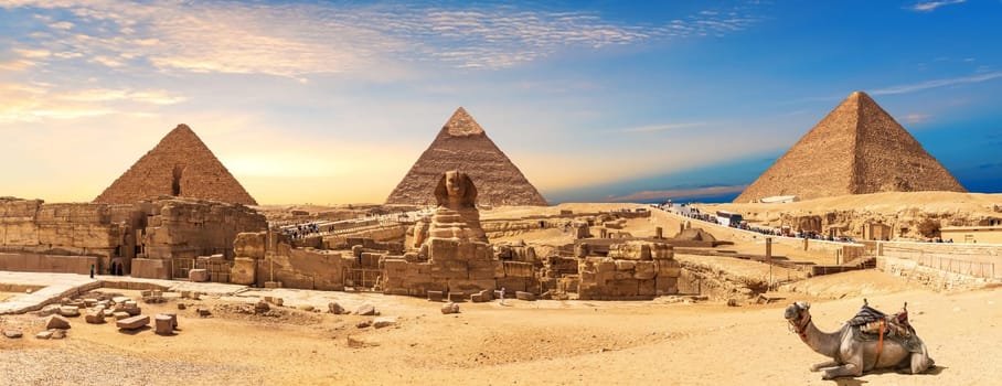 Giza Pyramids and Sphinx panorama with a camel lying by, Cairo, Egypt.