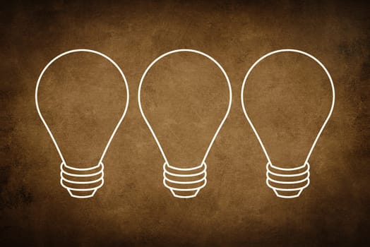 A white bulb on a dark brown textured background, symbol for idea, creativity, business, planing
