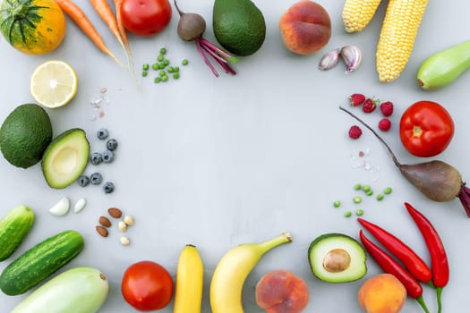 Flat lay with different food, organic vegetables, bio fruits, berries, nuts, spices, herbs. Copy space area for some text. Veggies on grey concrete background. Organic bio food healthy eating concept