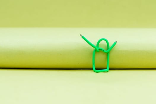 Hands in the air. Abstract Human Figure of Paper Clip. Creative Photography. Still life. Copy Space