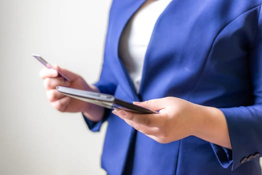 Technology network and online banking and internet banking and networking people concept, Business women with laptop and credit card with coin money on business office table