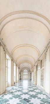VENARIA REALE, ITALY - CIRCA MAY 2021: corridor with floor made of luxury marbles. Plenty of elegance for this Italian interior in Venaria Reale, Piedmont region.