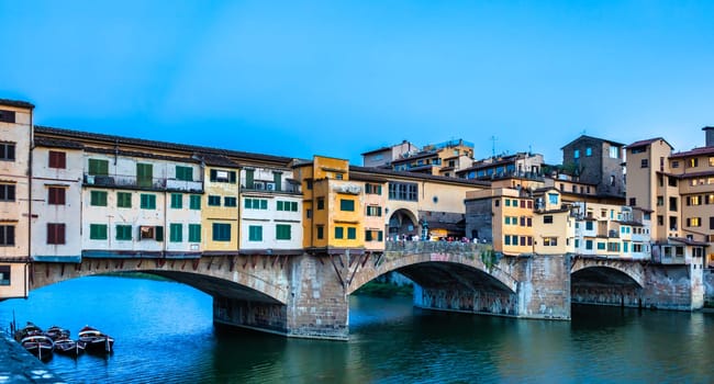 Florence, Italy - Circa June 2021: sunset on Ponte Vecchio - Old Bridge. Amazing blue light before the evening.