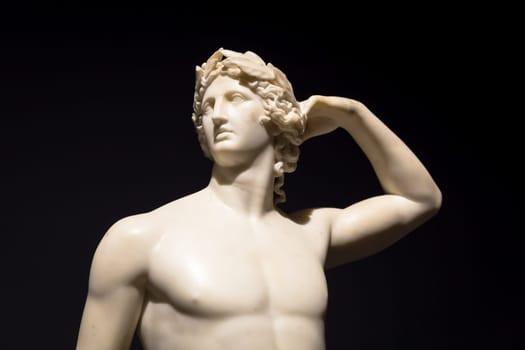 MILAN, ITALY - June 2020:  the ancient sculpture Apollo Crowning Himself - 1782 - Antonio Canova's masterpiece. Intesa Italian Museum.