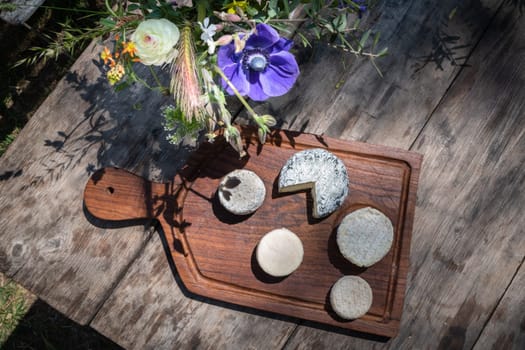 Cheese plate on a wooden table in the south of France