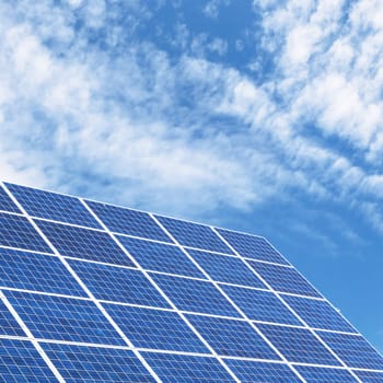 Solar panels for clean energy with a blue sky background.