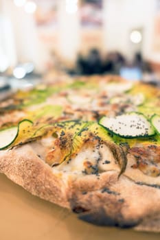 Delicious pizza with salmon and vegetables. italian pizza. Background. Shallow DOF.
