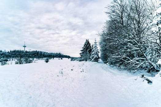 Beautiful landsape scene with a lot of snow in winter in Hesse Germany