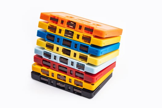 Collection of colorful audio tapes on white background