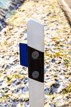 Road Marker in detail with snowy background