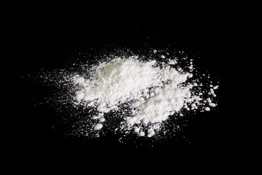 Baby talcum powder on black background