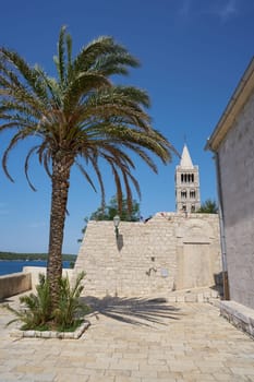 Viewpoint next to the church of St. Mary's Assumption in the old town of Rab in Croatia with a view of the bell tower behind it
