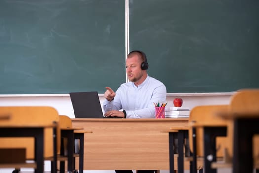 Back to School Concept. School teacher giving virtual teaching remote class online lesson by zoom conference call on laptop computer.
