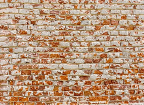 The Old brick wall with white paint background texture close up