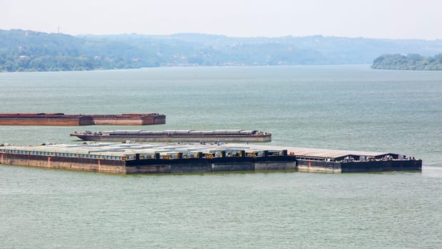 The barge transports cargo on the river. Selectine focus